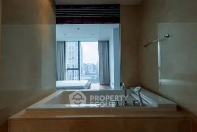 Luxurious bathroom with a modern bathtub and city view, perfect for relaxation.