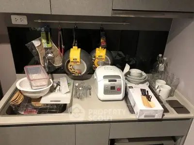 Modern kitchen countertop with appliances and utensils, showcasing efficient storage solutions.