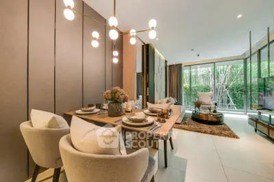 Luxurious open-plan living and dining area with elegant decor and garden view.