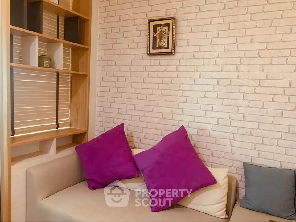 Cozy living room with modern decor and vibrant cushions on a comfortable sofa.