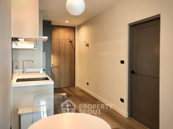 Modern kitchen with sleek design and open layout in a contemporary apartment.