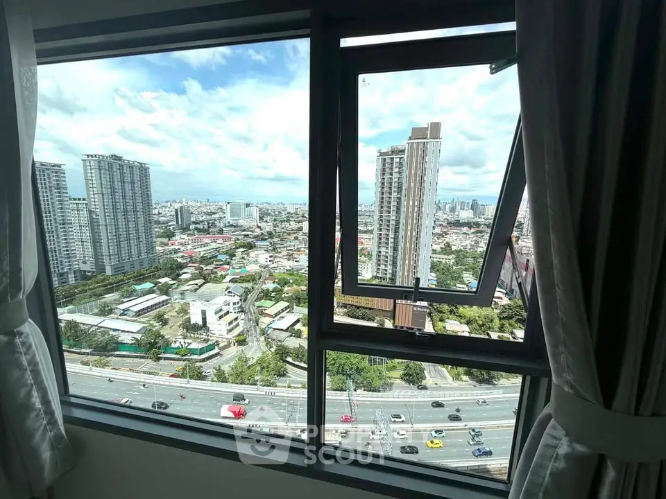 Stunning cityscape view from high-rise apartment window, showcasing urban skyline and vibrant city life.