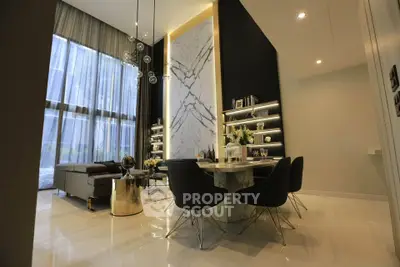 Luxurious modern living room with high ceilings, elegant dining area, and floor-to-ceiling windows.