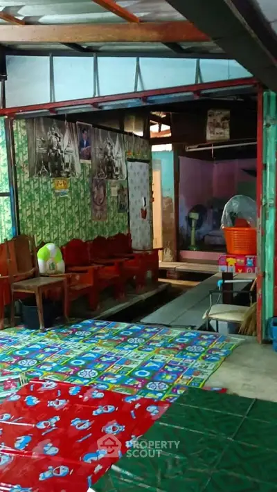 Cozy and colorful living space with eclectic decor and vibrant flooring
