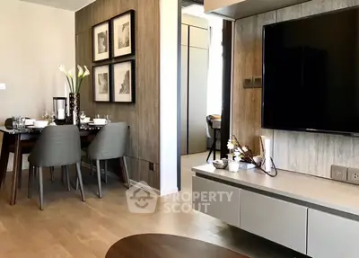 Modern living room with stylish dining area and wall-mounted TV, perfect for contemporary urban living.