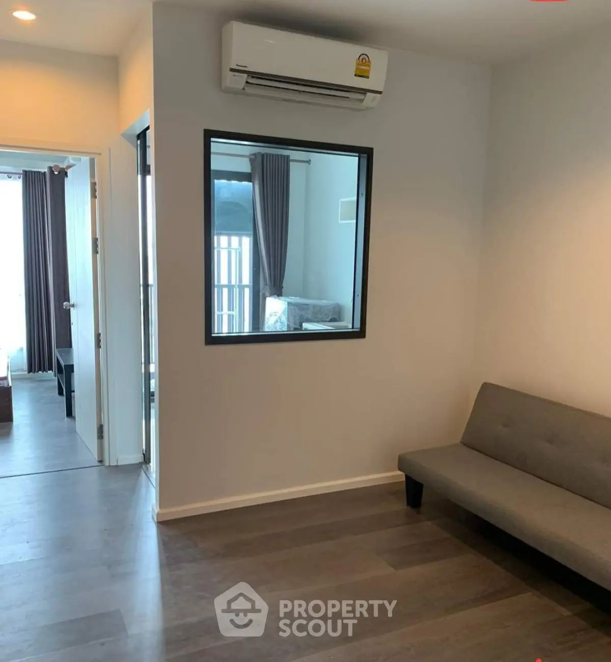 Modern apartment interior with air conditioning and minimalist furniture