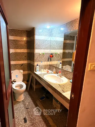 Compact bathroom with granite countertops and modern fixtures