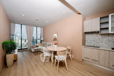 Modern open-plan living room with city view and stylish decor