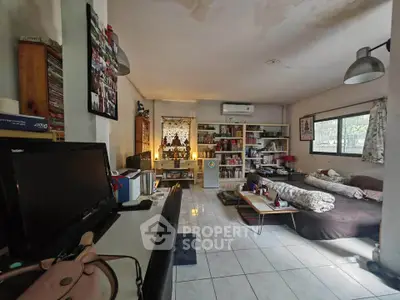 Spacious living room with cozy seating and ample natural light