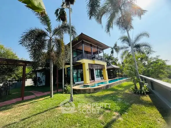 Stunning tropical villa with lush garden and private pool, perfect for luxury living.