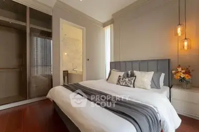 Luxurious bedroom with elegant decor and modern lighting in a high-end apartment.