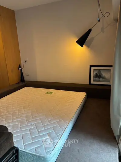 Cozy bedroom with modern lighting and minimalist decor