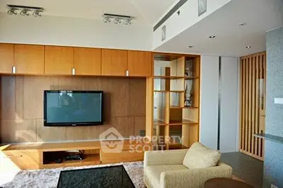 Modern living room with built-in wooden cabinets and flat-screen TV