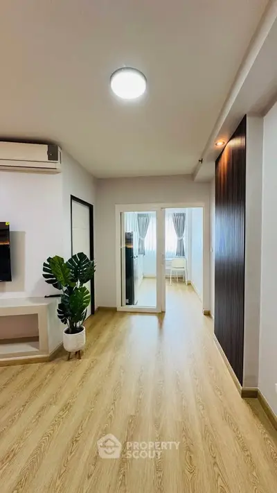 Modern living room with wooden flooring and stylish decor