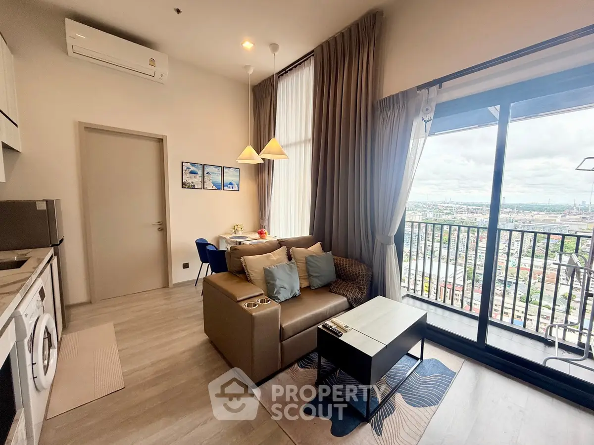Modern living room with city view and balcony access in high-rise apartment