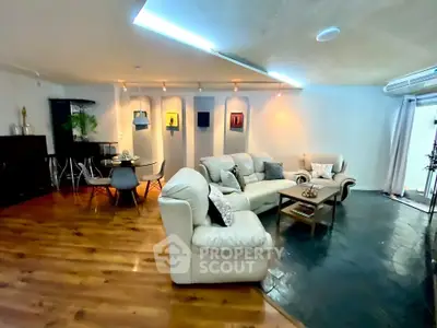 Spacious living room with modern decor and cozy seating area