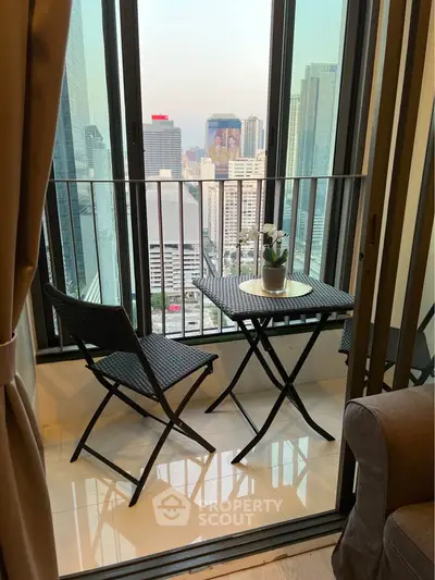 Chic urban balcony with city skyline view, perfect for relaxation and enjoying the vibrant cityscape.