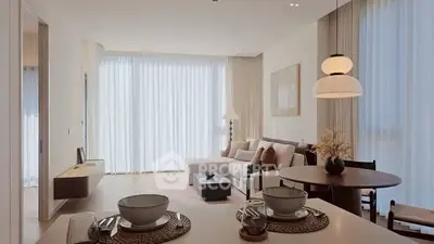 Elegant living room with modern decor and natural light, featuring a cozy seating area and dining space.