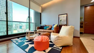 Stylish modern living room with floor-to-ceiling windows and city view