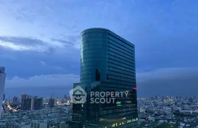 Stunning cityscape view with modern glass building at dusk
