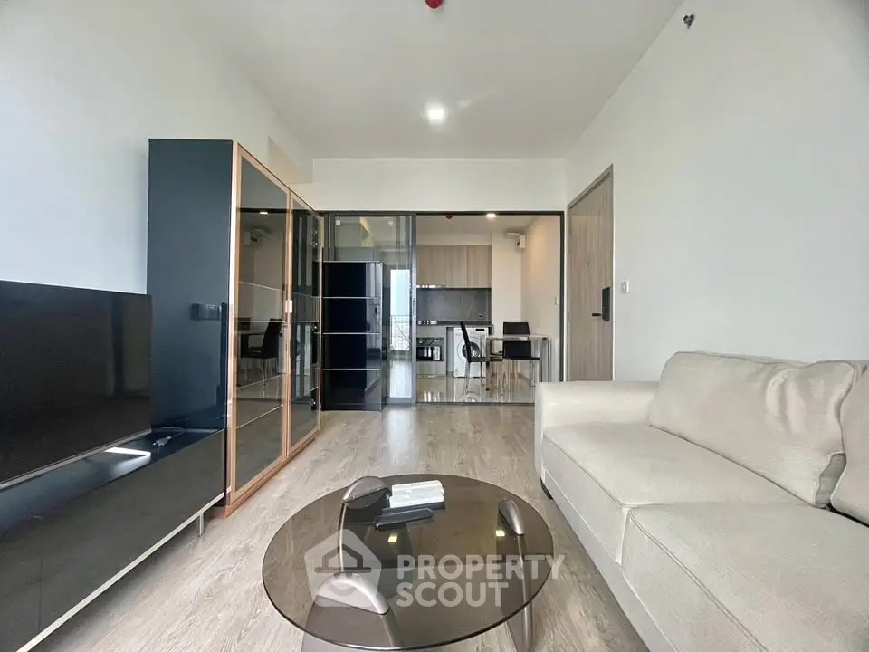 Modern living room with sleek furniture and open layout in a contemporary apartment.