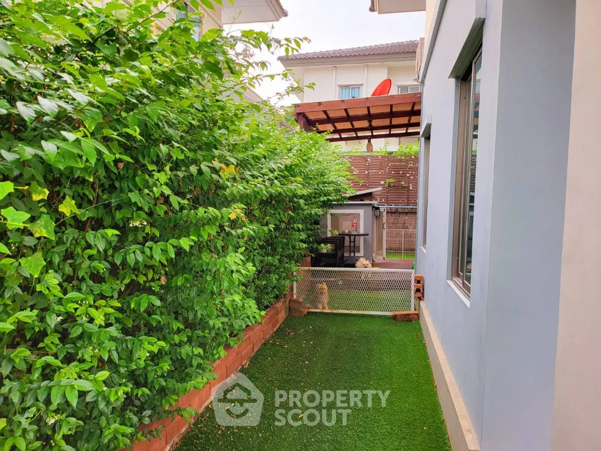 Charming garden area with lush greenery and modern home exterior