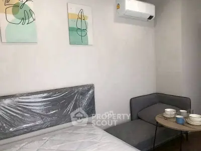 Modern bedroom with minimalist decor and air conditioning unit