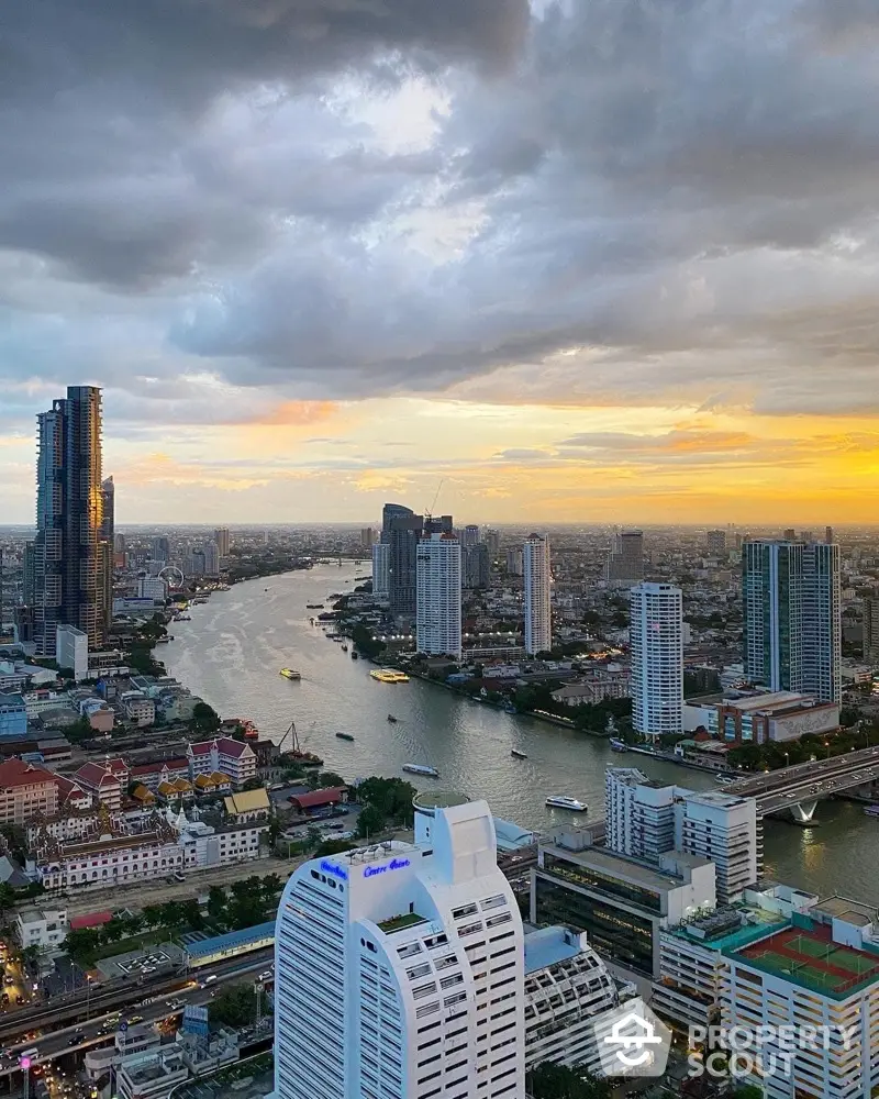 Stunning cityscape view with river and skyscrapers at sunset