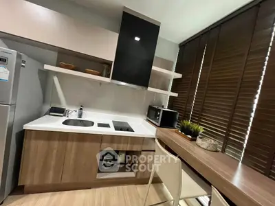 Modern kitchen with sleek design, featuring built-in appliances and stylish wooden blinds.