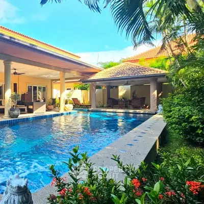 Luxurious villa with private pool and lush garden, perfect for tropical living.