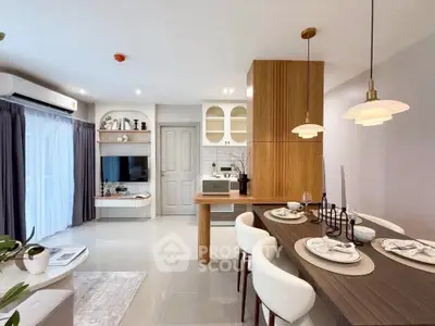 Modern open-plan living room and dining area with stylish decor and natural light.