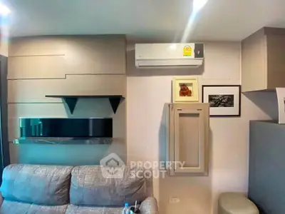 Modern living room with sleek design and air conditioning unit