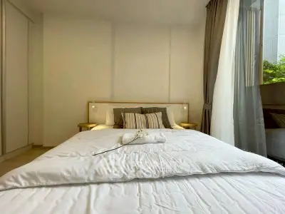 Cozy bedroom with large window and elegant decor