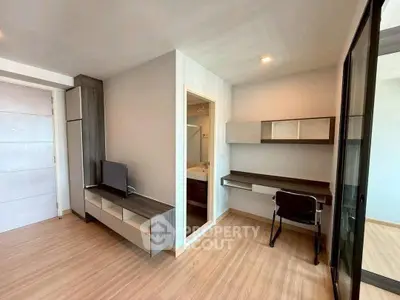 Modern apartment interior with study area and sleek design, perfect for urban living.