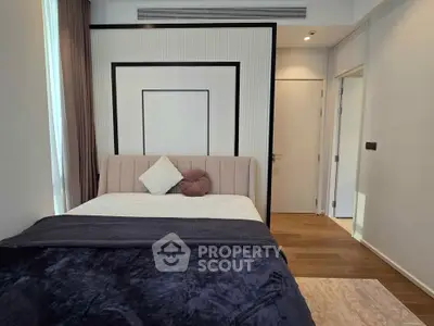 Modern bedroom with stylish decor and cozy bedding