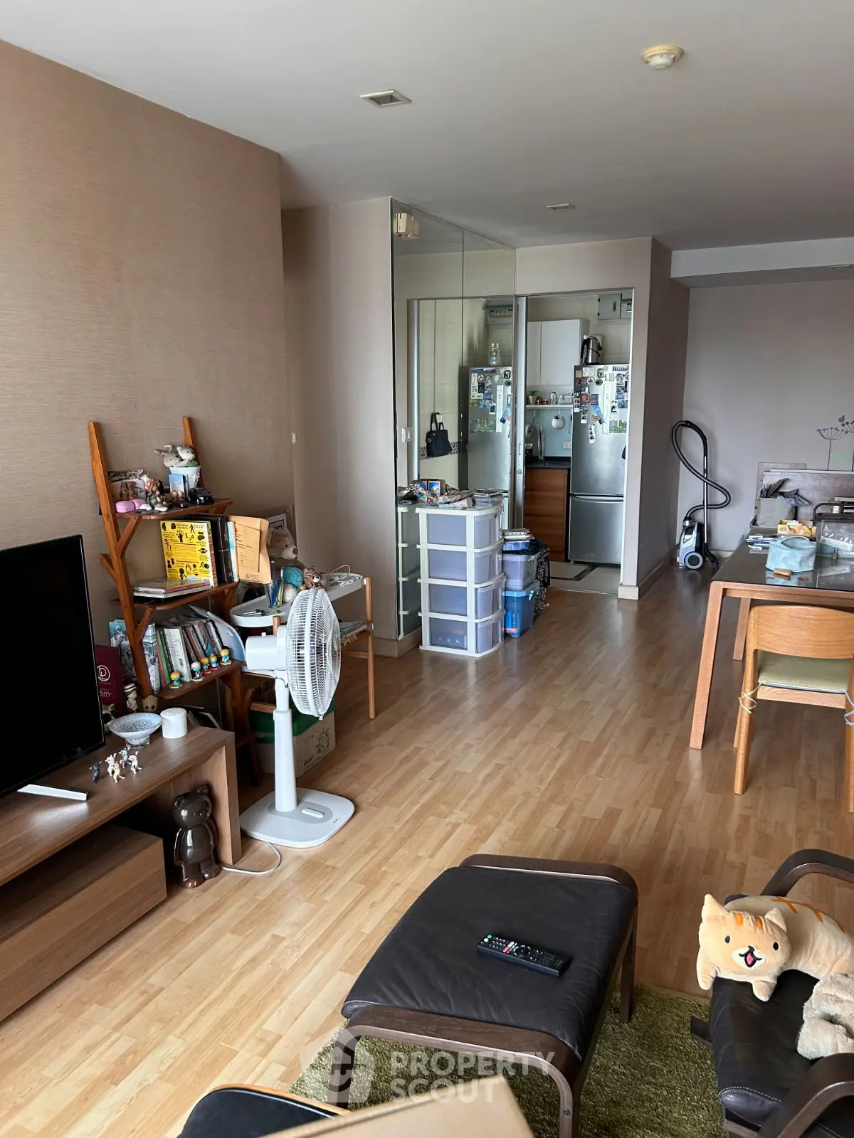 Spacious living room with modern decor and wooden flooring