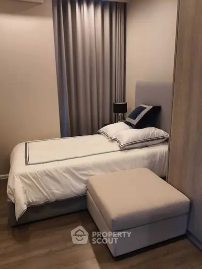 Cozy bedroom with elegant decor and plush bedding in modern apartment