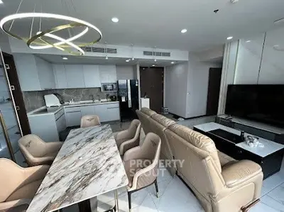 Luxurious open-plan living room with modern kitchen and elegant dining area.