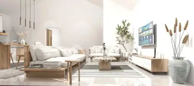 Modern living room with sleek furniture and wall-mounted TV, open to a stylish kitchen.