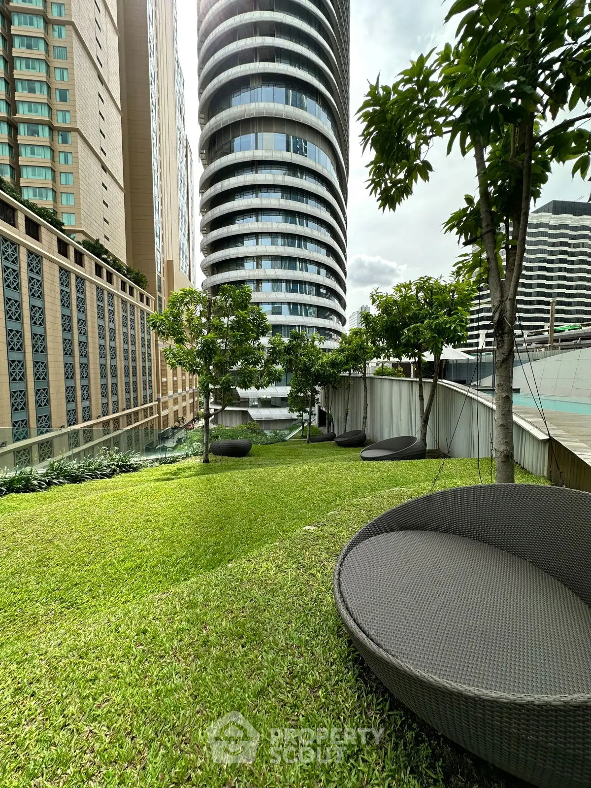 Luxurious urban garden with modern architecture and lush greenery