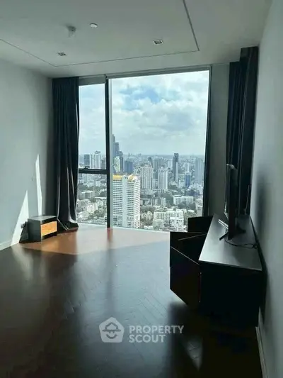 Spacious room with stunning city view and modern furnishings.