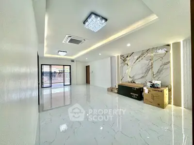 Spacious modern living room with marble flooring and elegant lighting
