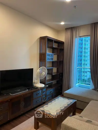 Cozy living room with modern furniture and city view window