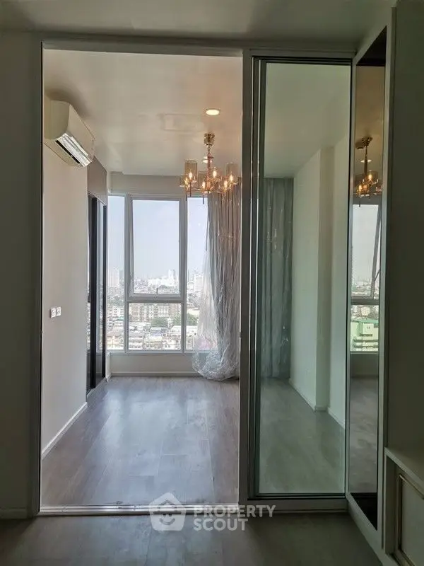 Modern apartment with floor-to-ceiling windows and city view