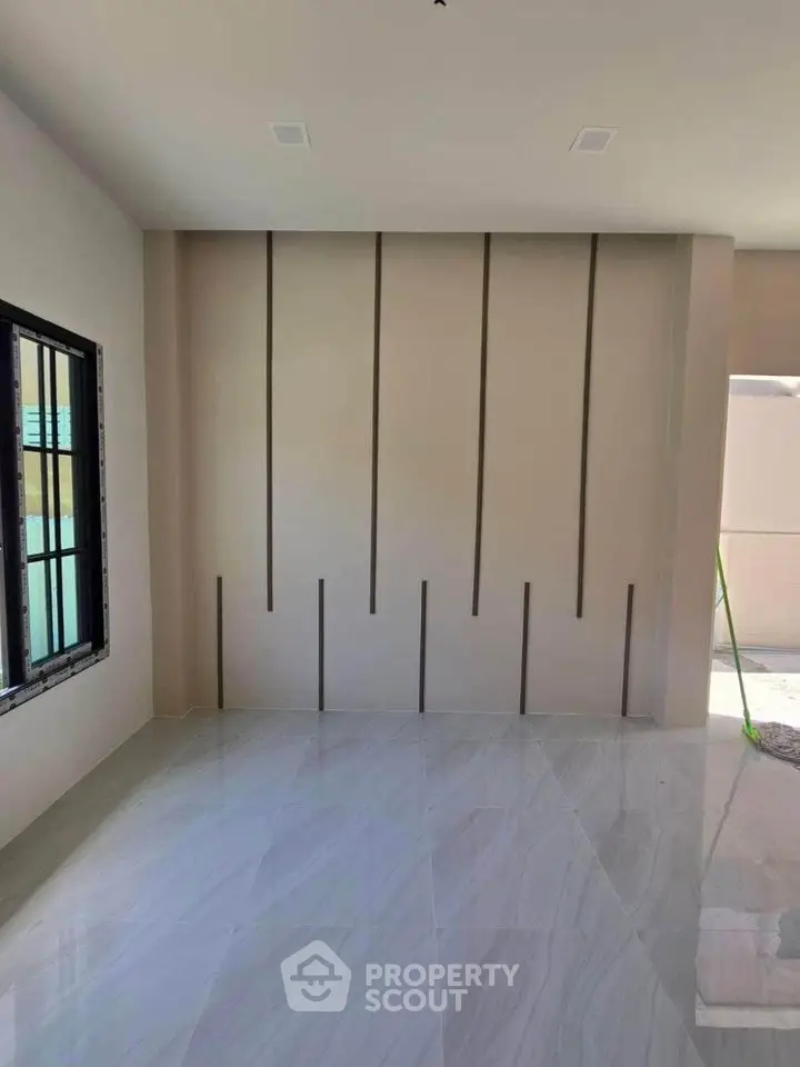 Modern empty room with sleek design and large window
