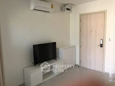 Modern living room with air conditioning and sleek TV setup