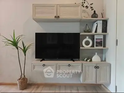 Modern living room with stylish TV unit and decor accents