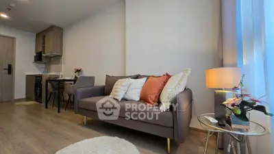 Modern living room with cozy sofa and stylish decor in open-plan apartment