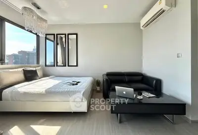 Modern studio apartment with sleek design and natural light