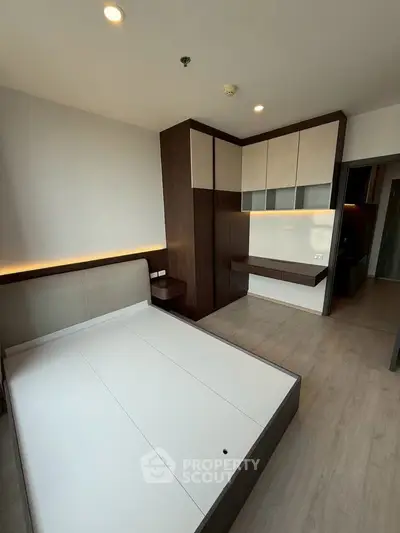 Modern bedroom with built-in wardrobe and sleek design